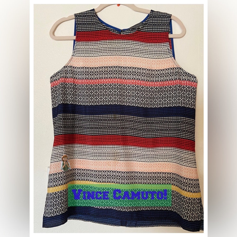 Top designed  by Vince Camuto. Soft silk like easy care fabric. Wear it,love it!